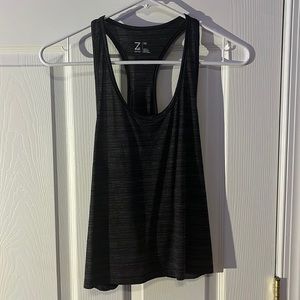 An Xs cropped muscle T-shirt, the back see thru fabric. Very light weight
